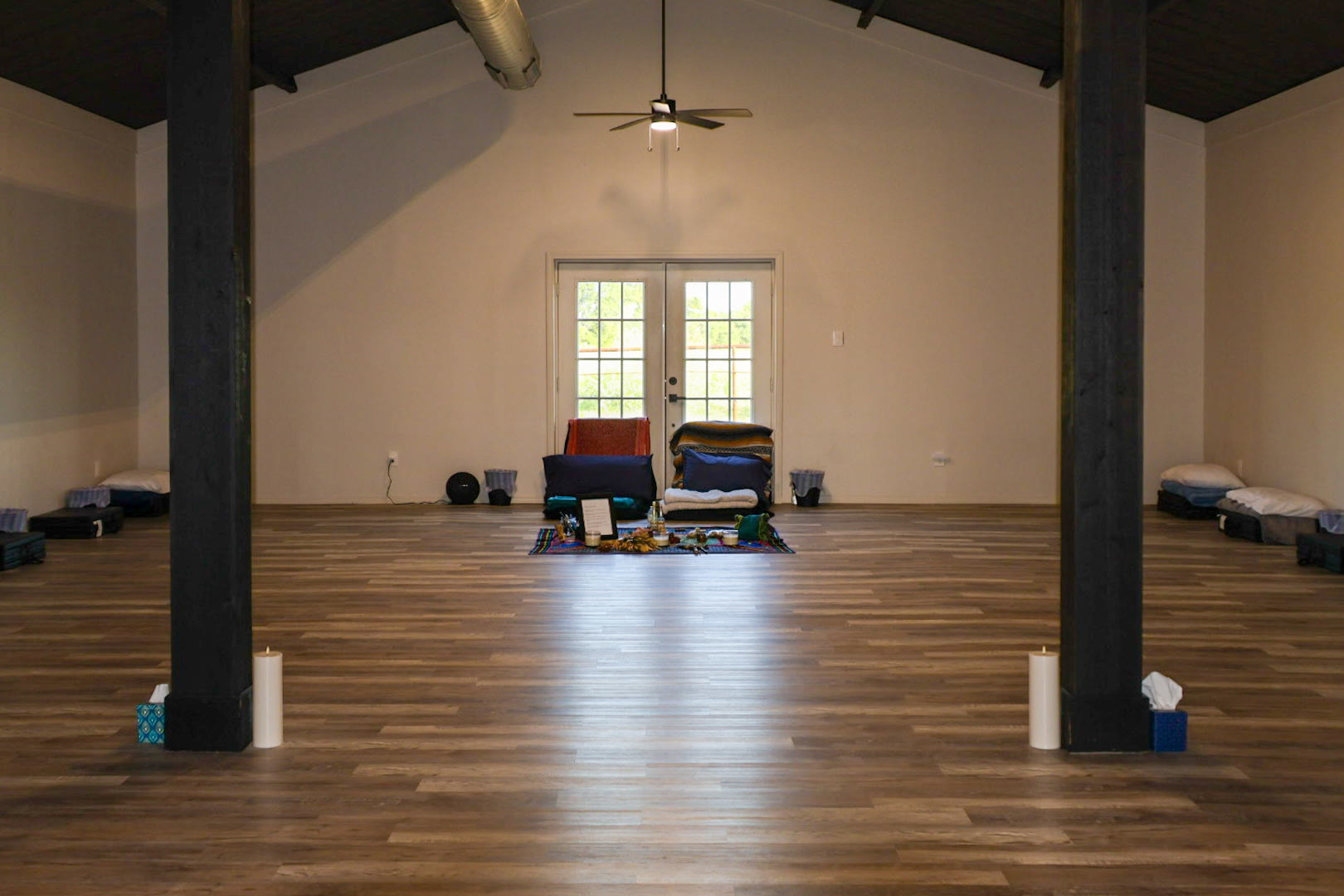 The interior of the ceremony barn at the AyaWaken Ranch, mats arranged around a central altar