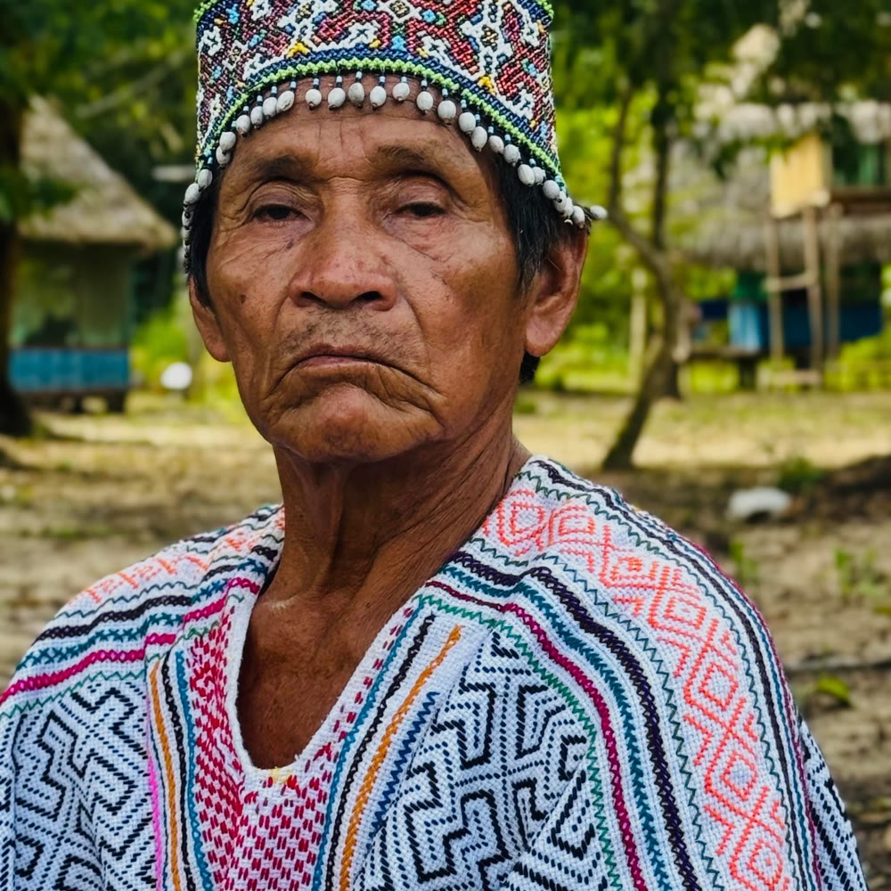 A Shipibo Maestro in a beaded corona and traditional kene garment